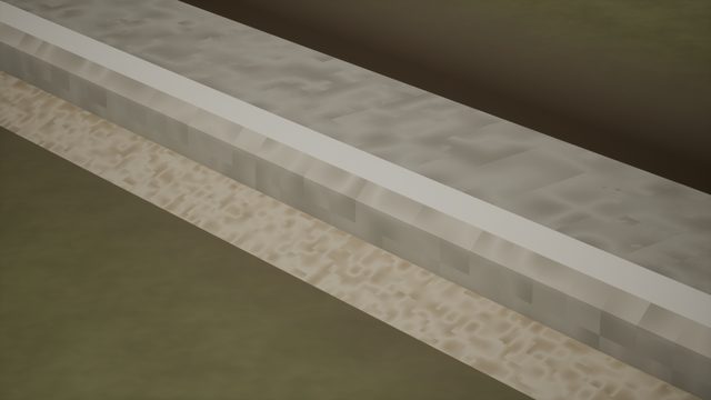 Close-up of a raised grey concrete strip with a sandy edge on olive ground (a texture close-up; no platform is visible)